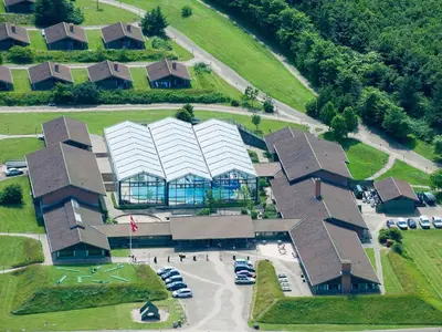 an overhead view of a building with cars in a parking lot at Type2 holiday home in Hanstholm in Hanstholm