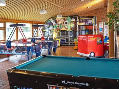 a billiard room with two tables and a pool table at Vegsø Holiday Park Premium Retreat in Hanstholm