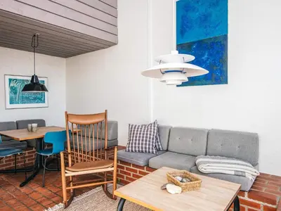 a living room with a couch and a table at 6 person holiday home in Brovst in Brovst