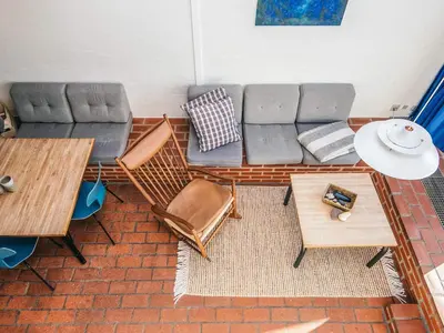 a living room with a couch and a table at 6 person holiday home in Brovst in Brovst