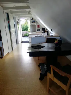 a kitchen with a sink and a counter top at Hunetorpvej Holiday Apartment in Blokhus