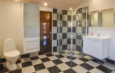 a bathroom with a toilet and a shower and a sink at Lovely Home In Vinderup With Wifi in Vinderup