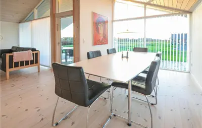 a dining room with a table and chairs at Lovely Home In Vinderup With Wifi in Vinderup