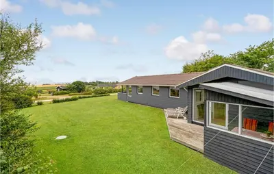 a house with a large yard in front of it at 3 Bedroom Stunning Home In Snedsted in Snedsted