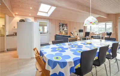 a kitchen and dining room with a table and chairs at Amazing Home In Thisted With Kitchen in Thisted