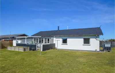 a white house with a yard in front of it at 2 Bedroom Lovely Home In Thisted in Thisted