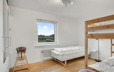 a bedroom with a bunk bed and a window at 2 Bedroom Lovely Home In Thisted in Thisted