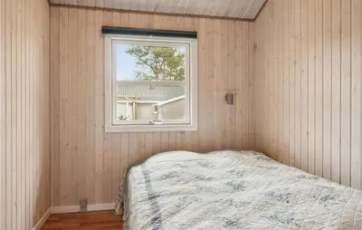 a bedroom with a bed and a window at Stunning Home In Fjerritslev With Wifi in Fjerritslev
