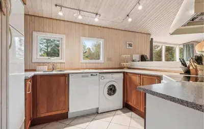 a kitchen with a washer and dryer at Stunning Home In Fjerritslev With Wifi in Fjerritslev