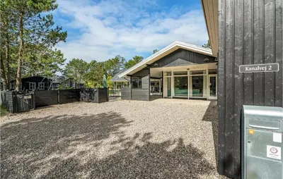 an empty driveway in front of a house at 4 Bedroom Beautiful Home In Vestervig in Vestervig