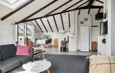 a living room with a couch and a table at Amazing Home In Thisted With Wifi in Thisted