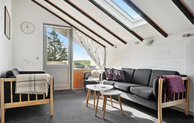 a living room with a couch and a table at Amazing Home In Thisted With Wifi in Thisted