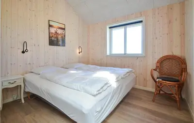 a bedroom with a white bed and a window at Amazing Home In Thisted With Sauna in Thisted