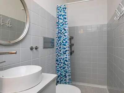 a bathroom with a sink and a shower at 4 person holiday home on a holiday park in Lemvig in Lemvig