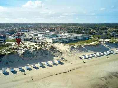 an aerial view of a building on a beach at 6 person holiday home on a holiday park in Blokhus in Blokhus