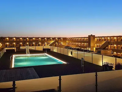 a large swimming pool in the middle of a building at 6 person holiday home on a holiday park in Blokhus in Blokhus