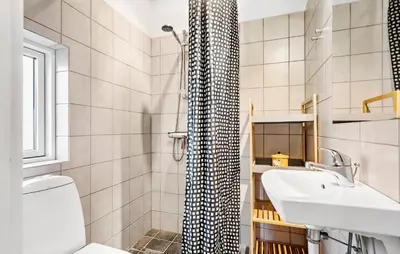 a bathroom with a sink and a toilet and a shower at Gorgeous Home In Harboøre With Wifi in Harboør