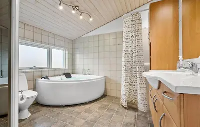 a bathroom with a tub and a toilet and a sink at Gorgeous Home In Harboøre With Wifi in Harboør