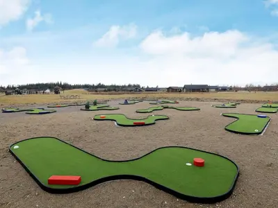 a group of miniature golf courses in a field at 6 person holiday home in Brovst in Brovst
