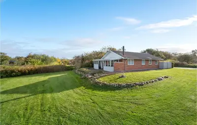 a house with a large yard in front of it at Cozy Home In Vinderup With Wifi in Vinderup