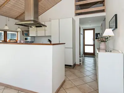 a kitchen with white cabinets and a counter top at Tranquil Retreat in Thorsminde-By Traum in Ulfborg