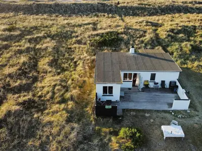 an aerial view of a white house with a deck at 4 person holiday home in Fjerritslev in Fjerritslev