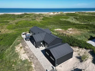 an overhead view of a house on the beach at 10 person holiday home in Løkken in Løkken