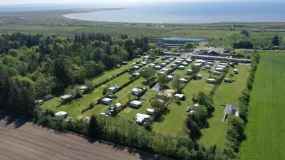 an aerial view of a parking lot with parked vehicles at Bygholm Camping og aktiviteter in Vesløs