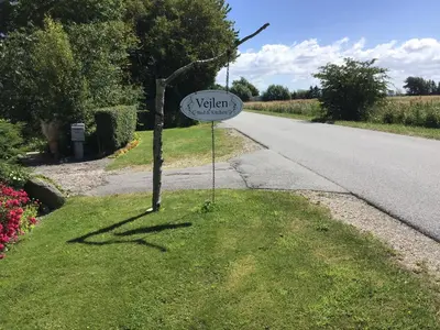 a sign on the side of a road at Vejlen Bed & Kitchen in Vadum