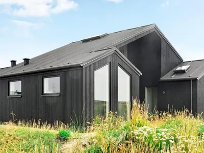 a black house with a black roof at 10 person holiday home in Harboøre-By Traum in Harboør