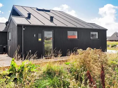 a black house with a black roof at 10 person holiday home in Harboøre-By Traum in Harboør