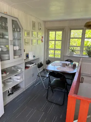 a kitchen with a table and chairs in it at Munkebo B&B, Thy in Thisted
