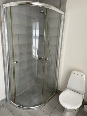 a shower stall with a toilet in a bathroom at Munkebo B&B, Thy in Thisted