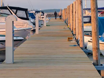 a wooden dock with boats parked on it at 10 person holiday home in Vinderup-By Traum in Vinderup