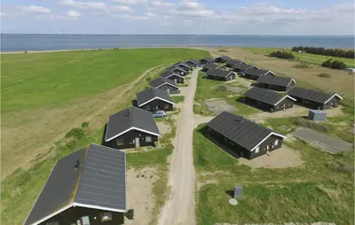 an aerial view of a row of houses in a field at Holiday Home Klitengene Xi in Ulfborg