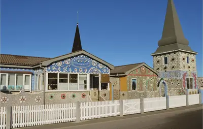 a building with a church with a steeple at Holiday Home Bjergehusvej in Harboør