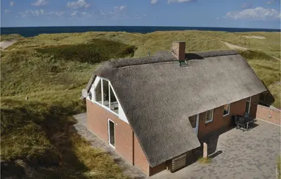 an overhead view of a house on the beach at Holiday Home Doblervej Harboøre X in Harboør