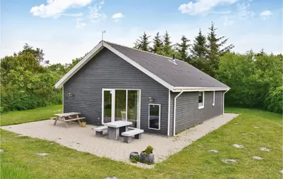 a gray shed with a picnic table and a bench at Beautiful Home In Vemb With Wifi in Vemb