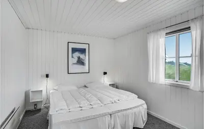 a white bedroom with a bed and a window at Stunning Home In Thisted With Sauna in Thisted