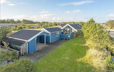 an aerial view of a house with blue roofs at Åbo in Thisted