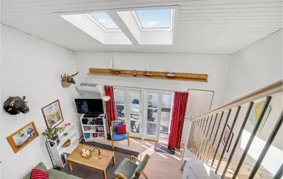 a living room with a skylight in the ceiling at Holiday Home Havnevej in Vestervig