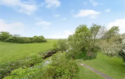 an aerial view of a field and trees at Holiday Home Årup Byvej in Snedsted