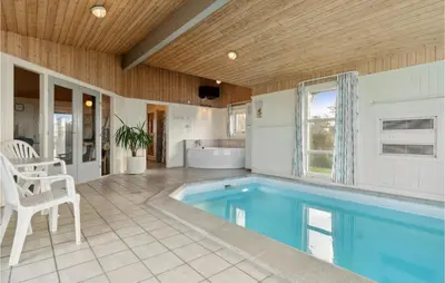 a home with a swimming pool and a tub at Stunning Home In Vestervig With Sauna in Vestervig
