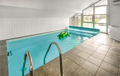 a swimming pool in a house with a pool at Lovely Home In Thisted With Wifi in Thisted