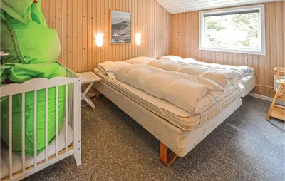 a bedroom with two bunk beds and a window at Lovely Home In Thisted With Wifi in Thisted