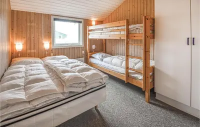 a bedroom with two bunk beds and a window at Lovely Home In Thisted With Wifi in Thisted
