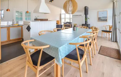 a kitchen and dining room with a table and chairs at Lovely Home In Thisted With Wifi in Thisted