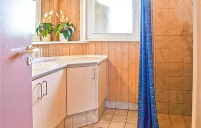a kitchen with a sink and a shower at Stunning Home In Thisted With Sauna in Thisted