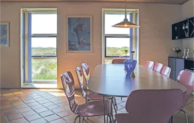a dining room with a table and chairs at Awesome Home In Thisted With Sauna in Thisted