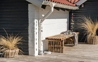 a porch with a bench on a wooden deck at Three-Bedroom Holiday Home In Thisted in Thisted